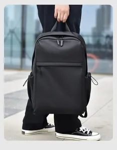 Minimalist black waterproof business backpack with side drawstring pockets and top handle