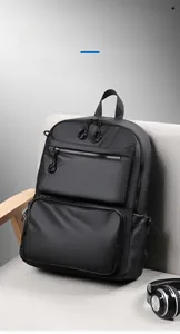 Detail view of large capacity black business travel backpack with waterproof nylon texture