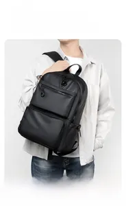 Detailed view of black business backpack showing water-resistant and scratch-resistant fabric
