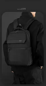 Smart storage design on business laptop backpack with water-resistant fabric and matte leather