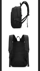Detail view of large capacity black backpack showing breathable mesh and luggage strap