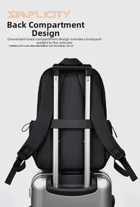 Detail showing the back luggage strap of the black business backpack on a suitcase handle