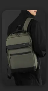 Detail of waterproof olive nylon business backpack with reinforced handle and metal zippers