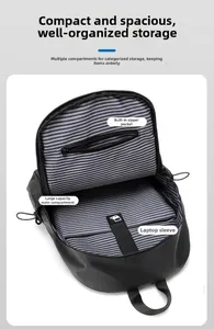 Detailed interior of black business backpack showing striped lining and laptop compartment