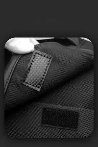 Detailed macro view of the smart storage space with hook and loop closure on backpack