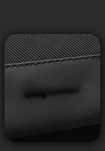 Detail of water-resistant fabric and embossed logo on professional black business backpack