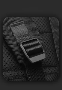 Detail of breathable honeycomb mesh padding and adjustable nylon straps on the black backpack