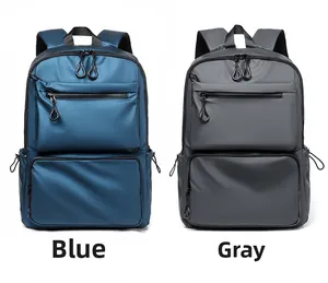 Detailed comparison of blue and grey business travel backpacks with multiple front zippers