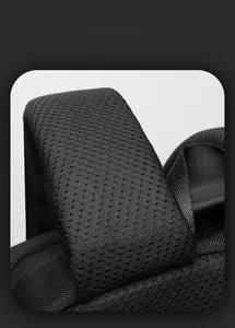 Macro detail of breathable honeycomb mesh shoulder straps on a black laptop backpack