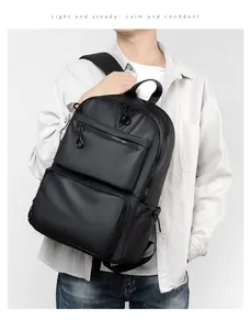 Detail of minimalist waterproof black business backpack with multiple zipper pockets