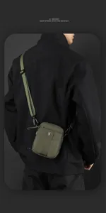 Detail view of army green nylon crossbody bag showing the adjustable strap and buckle
