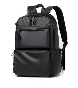 Detail of black commuter backpack with dual front zip pockets and ring pulls