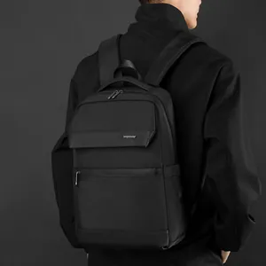 Waterproof business laptop backpack in black shown on male model in minimalist style