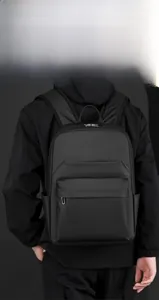 Detail view of the sleek black business backpack with matte finish and side pockets