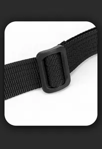 Detailed close-up of the adjustable nylon shoulder strap and matte plastic buckle
