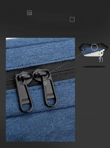Detailed macro view of high-quality SBS metal dual zippers on a blue cycling waist bag