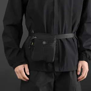 Versatile black waterproof nylon crossbody waist bag with dual zipper compartments