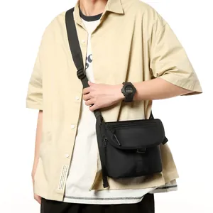Men's black nylon crossbody bag with adjustable strap and multiple zip compartments