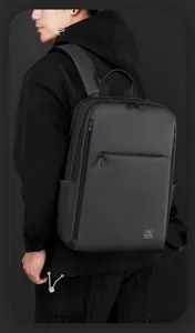 Close-up of WEPOWER waterproof business backpack with ergonomic handle and matte texture