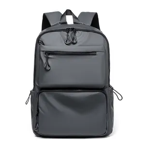 Dark grey waterproof business backpack with multiple zippered pockets for travel laptop