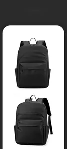 Detail view of the sleek matte black business backpack featuring smart storage pockets