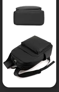 Detail of waterproof black nylon backpack showing zippers and breathable mesh straps