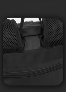 Detail of breathable mesh back padding and reinforced nylon straps on black business backpack