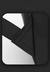 Detail of reinforced stitching on black business backpack shoulder strap connector