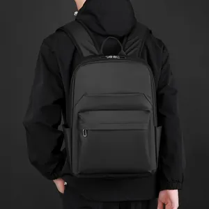 Waterproof black business backpack for men with sleek matte finish and multi-pocket design