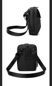 Detail of black tactical crossbody bag showing side brand tag and rear belt loops