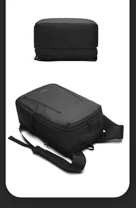 Detail of waterproof matte fabric with reinforced top handle and ergonomic padded straps