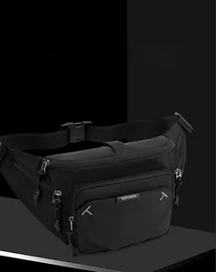 Close-up of black nylon waist bag featuring multiple zipper pockets and adjustable strap