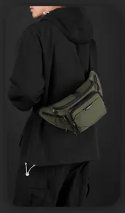 Detail view of military green crossbody bag with durable fabric and logo branding