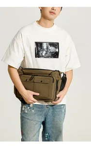 Brown nylon crossbody bag with multi-pocket design shown on model for daily use