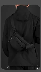 Outdoor crossbody chest bag for men in black durable nylon shown on model back view