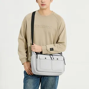 Light grey nylon messenger bag for men with double front pockets and adjustable strap