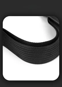 Detail of high-density woven strap and smart storage space on a black backpack
