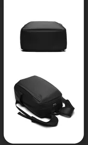 Detailed view of waterproof black backpack with padded mesh straps and durable base