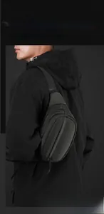 Detail view of durable scratch-resistant chest bag showing layered storage and texture