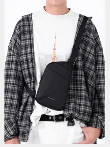 Close-up of black matte waterproof crossbody bag featuring minimalist white WE POWER logo