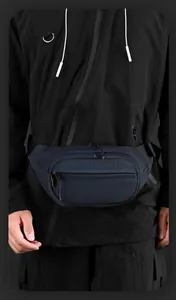 Detail of navy blue tactical chest bag showing durable fabric texture and zipper placement