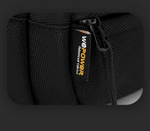 Detail of premium black woven fabric chest bag with heavy duty metal zipper and brand label
