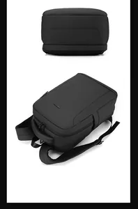 Detail of durable black business backpack featuring reinforced handle and ergonomic straps