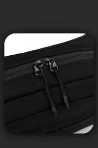 Detail of durable nylon weave fabric and SBS dual zippers on black outdoor chest bag