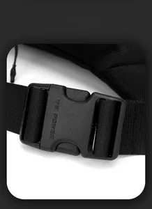 Macro detail of high-density nylon strap and buckle with brand engraving on the backpack