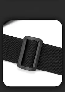 Detail of durable black adjustable shoulder strap and plastic buckle on outdoor chest bag