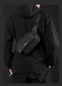 Detail of high-density nylon chest bag with metallic snaps and adjustable strap