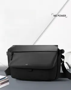 Close-up of waterproof fabric texture and heat-sealed zipper on black messenger bag