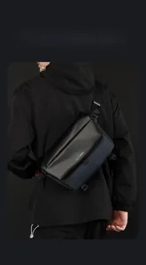 Detail of color-block messenger bag with durable fabric and logo for urban commuting