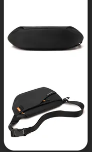 Makro-Detail der wasserdichten schwarzen Brusttasche mit orangefarbenen Reißverschlüssen